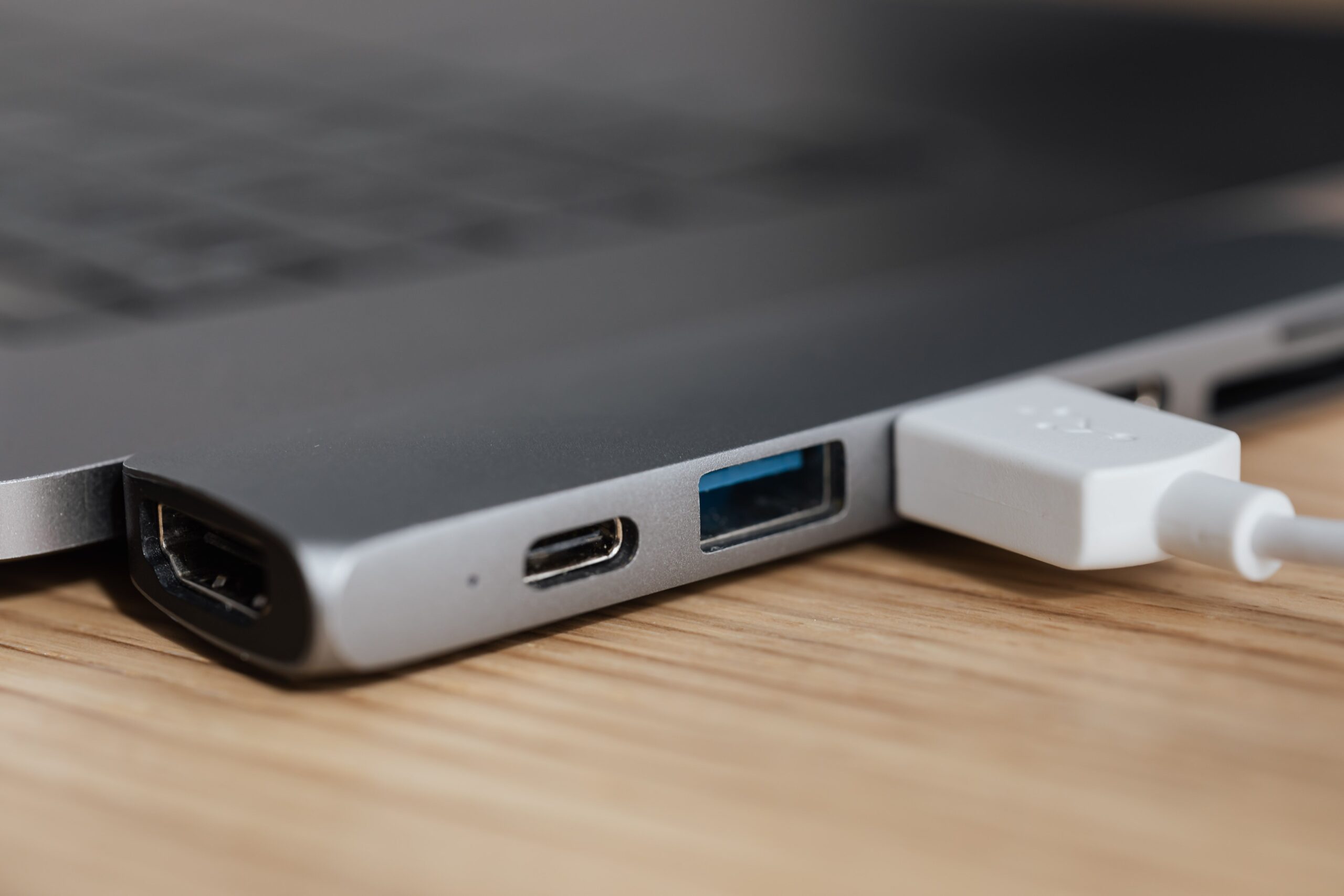 USB type adapter plugged into modern laptop USB type adapter plugged into modern laptop