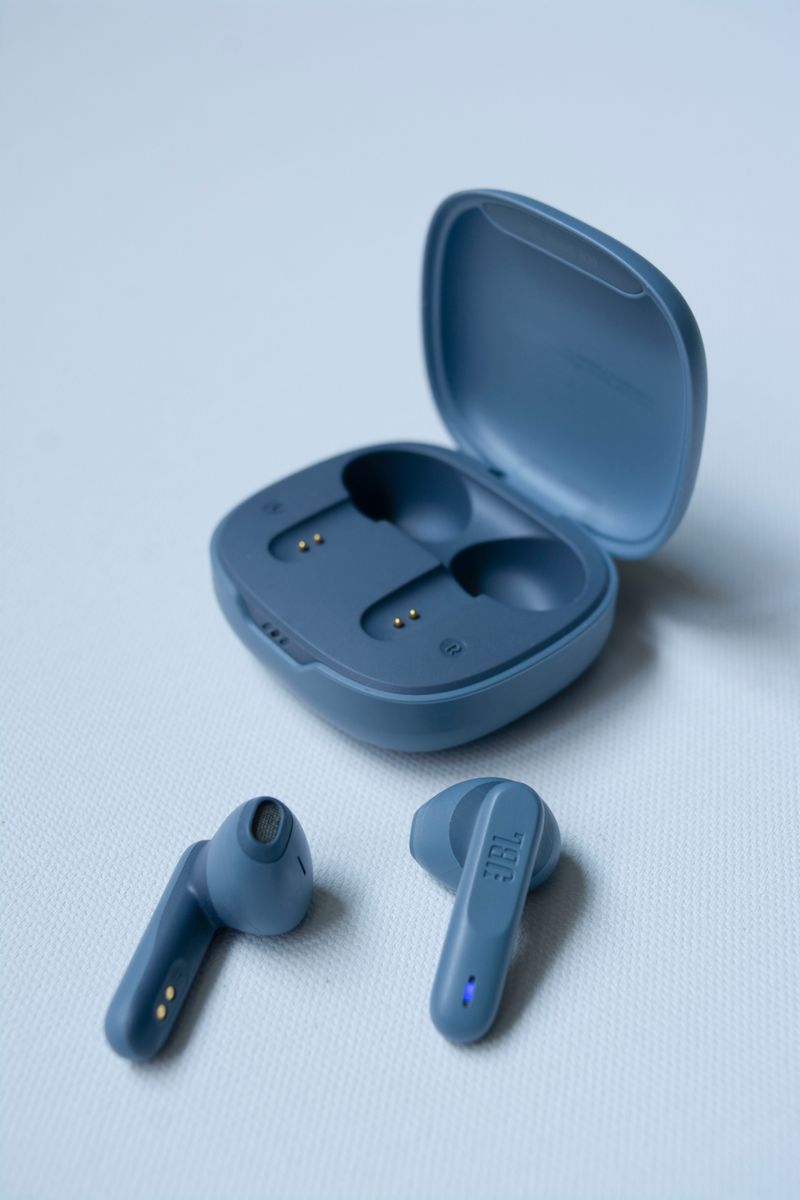 Close up of wireless earphones and case Close up of wireless earphones and case