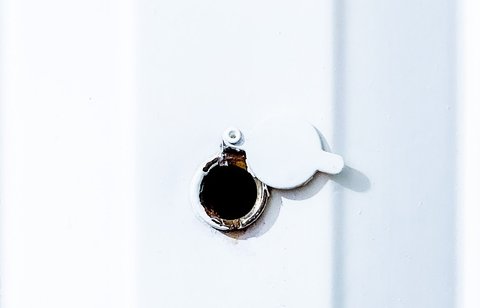 White door peephole mounting location for smart viewer installation