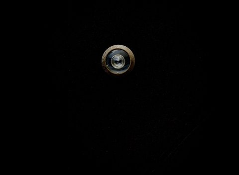 Close-up of a peephole lens similar to the CP4 outdoor camera view