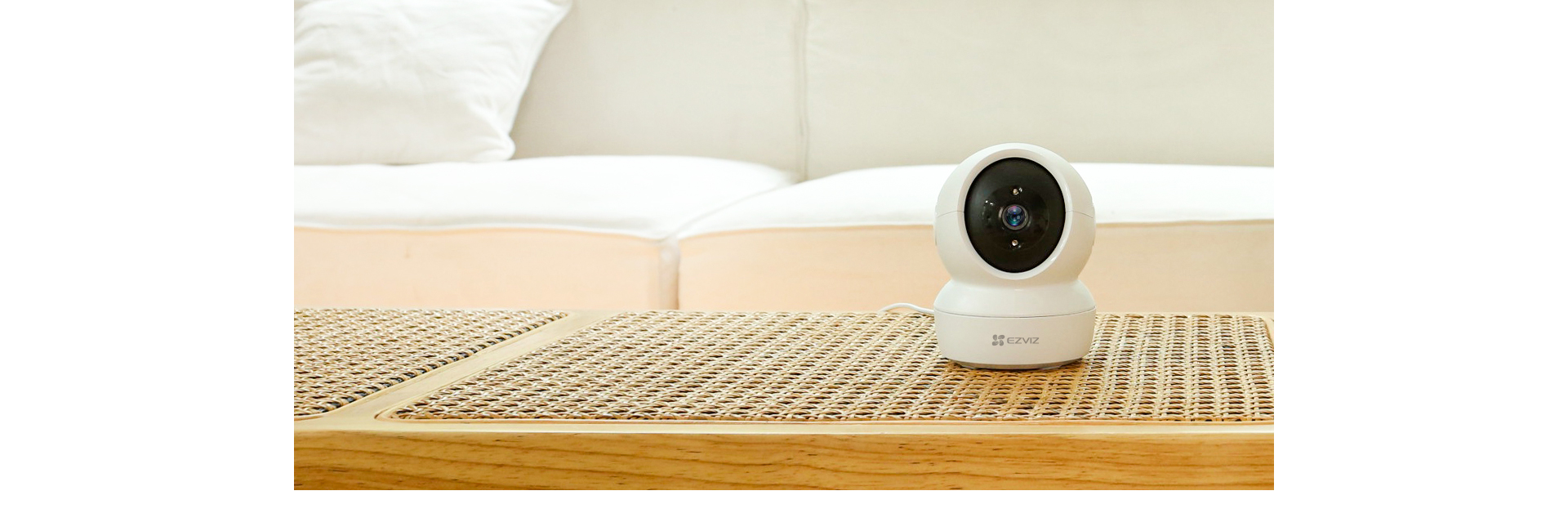 EZVIZ H6c 3MP camera on a living room table EZVIZ H6c 3MP camera on a living room table