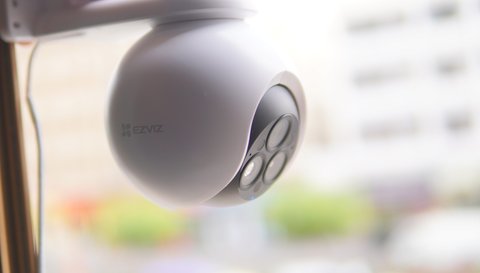 EZVIZ H80f Multi triple lens outdoor camera mounted near a window EZVIZ H80f Multi triple lens outdoor camera mounted near a window