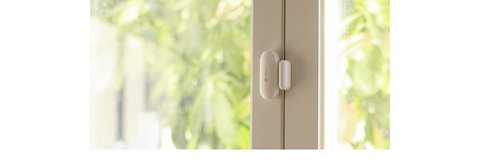 EZVIZ T2C open close sensor mounted on a window frame