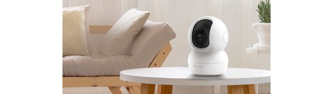 EZVIZ TY2 pan tilt indoor camera on a table for home monitoring EZVIZ TY2 pan tilt indoor camera on a table for home monitoring
