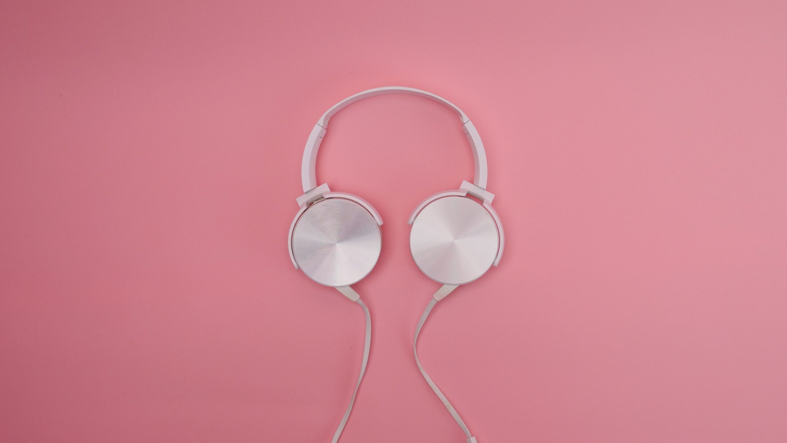Generic over-ear headphones on a plain background Generic over-ear headphones on a plain background