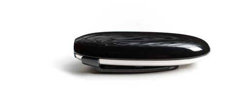 HiBy W5 Bluetooth receiver side profile showing pebble-shaped design HiBy W5 Bluetooth receiver side profile showing pebble-shaped design