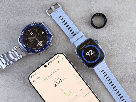 Smartwatch shown alongside a smartphone displaying fitness data Smartwatch shown alongside a smartphone displaying fitness data