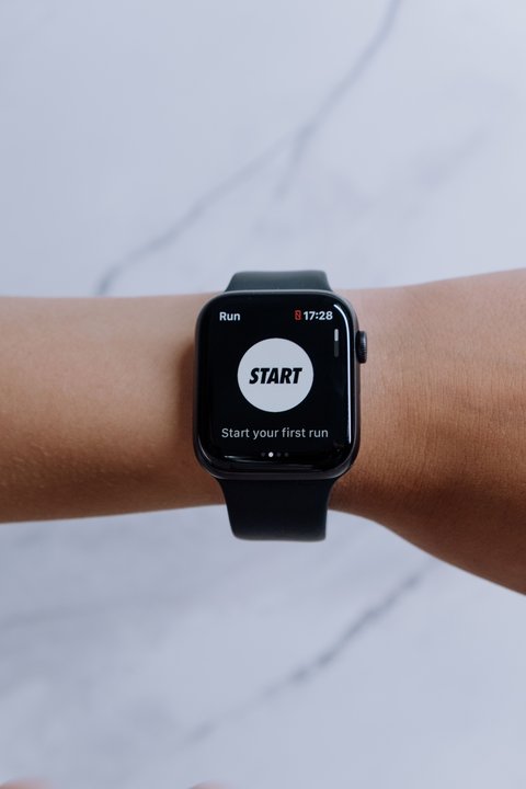 Close up of a black smartwatch showing an app on screen Close up of a black smartwatch showing an app on screen