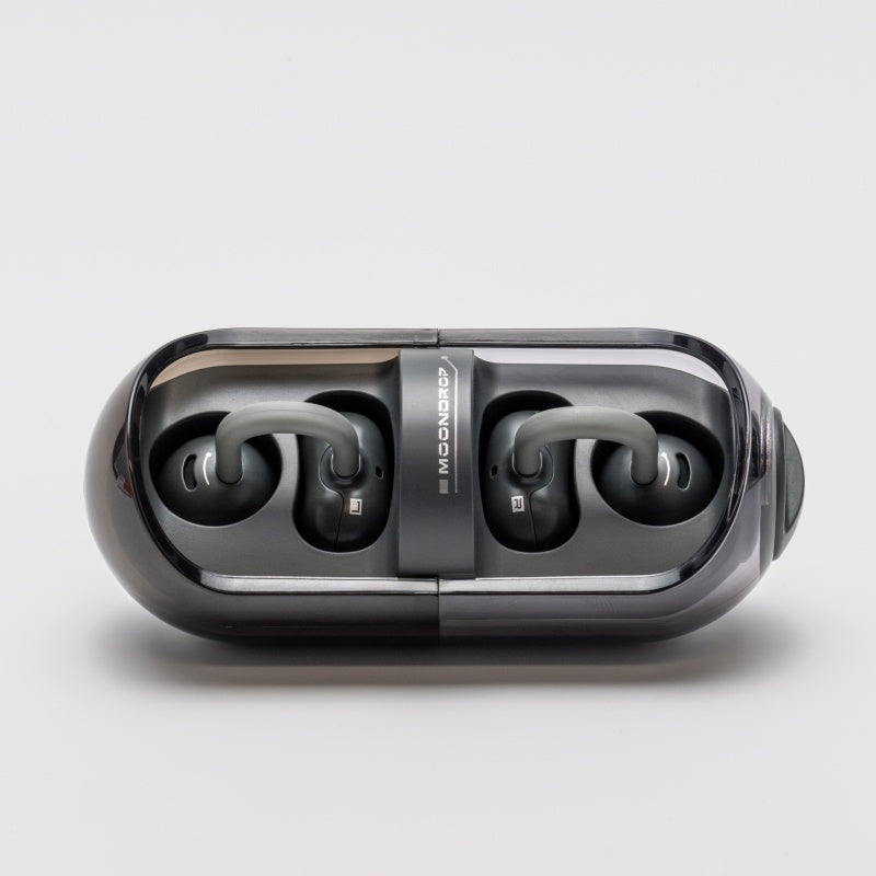 Moondrop Pill earbuds resting in open charging case Moondrop Pill earbuds resting in open charging case