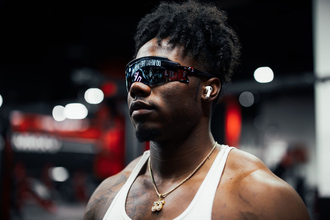 Person wearing wireless earphones during a workout Person wearing wireless earphones during a workout