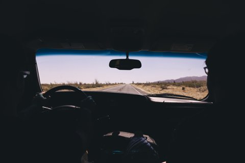 View through car windshield while driving on a highway