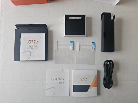 Shanling M1S digital audio player unboxed with accessories and manual Shanling M1S digital audio player unboxed with accessories and manual
