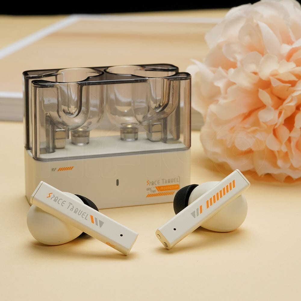 Moondrop Space Travel true wireless earbuds resting outside their charging case Moondrop Space Travel true wireless earbuds resting outside their charging case