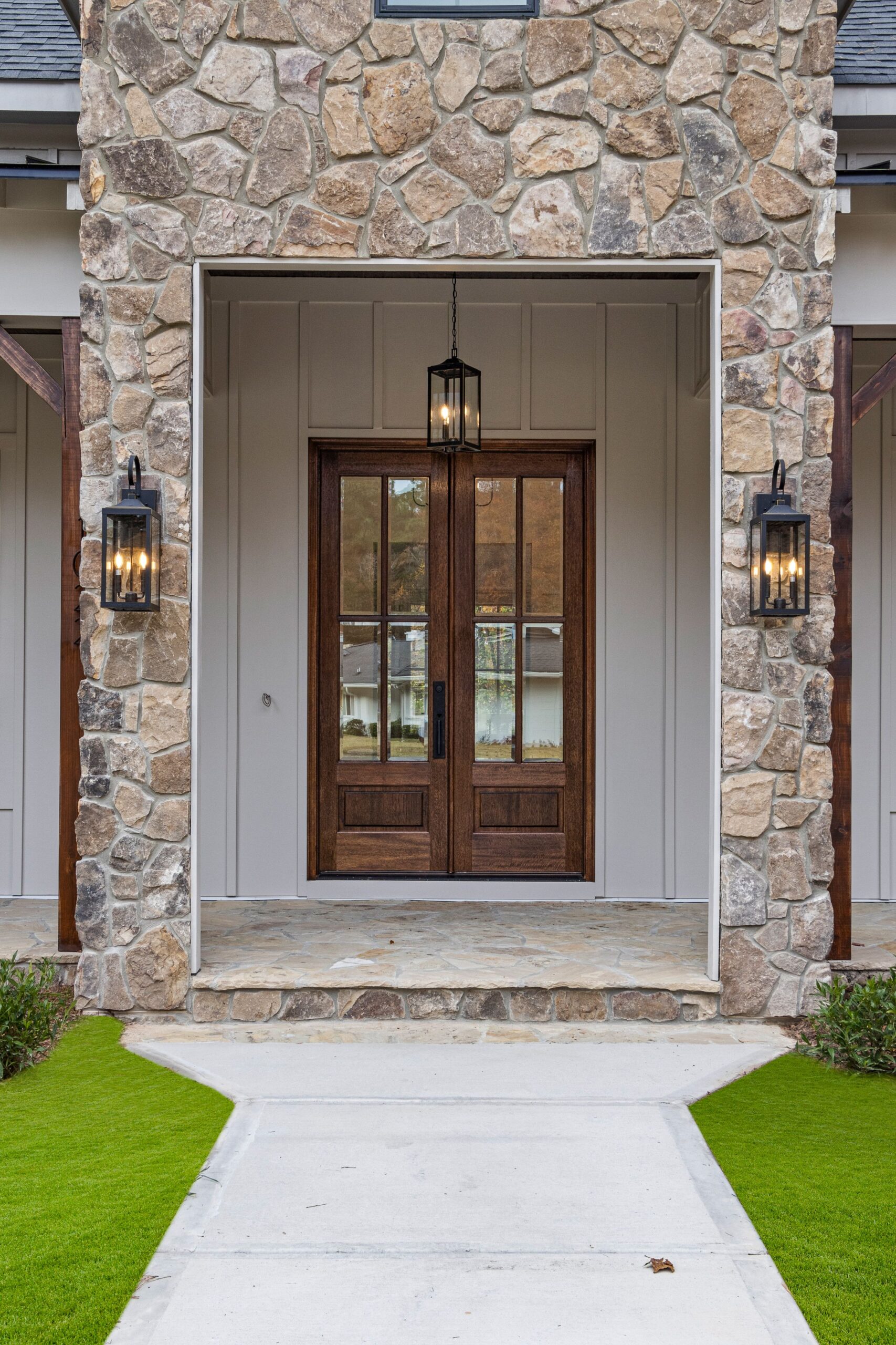 House front entrance with stone facade, a typical outdoor camera install location House front entrance with stone facade, a typical outdoor camera install location