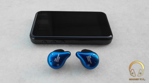 TFZ X1 earbuds next to a phone showing button controls TFZ X1 earbuds next to a phone showing button controls
