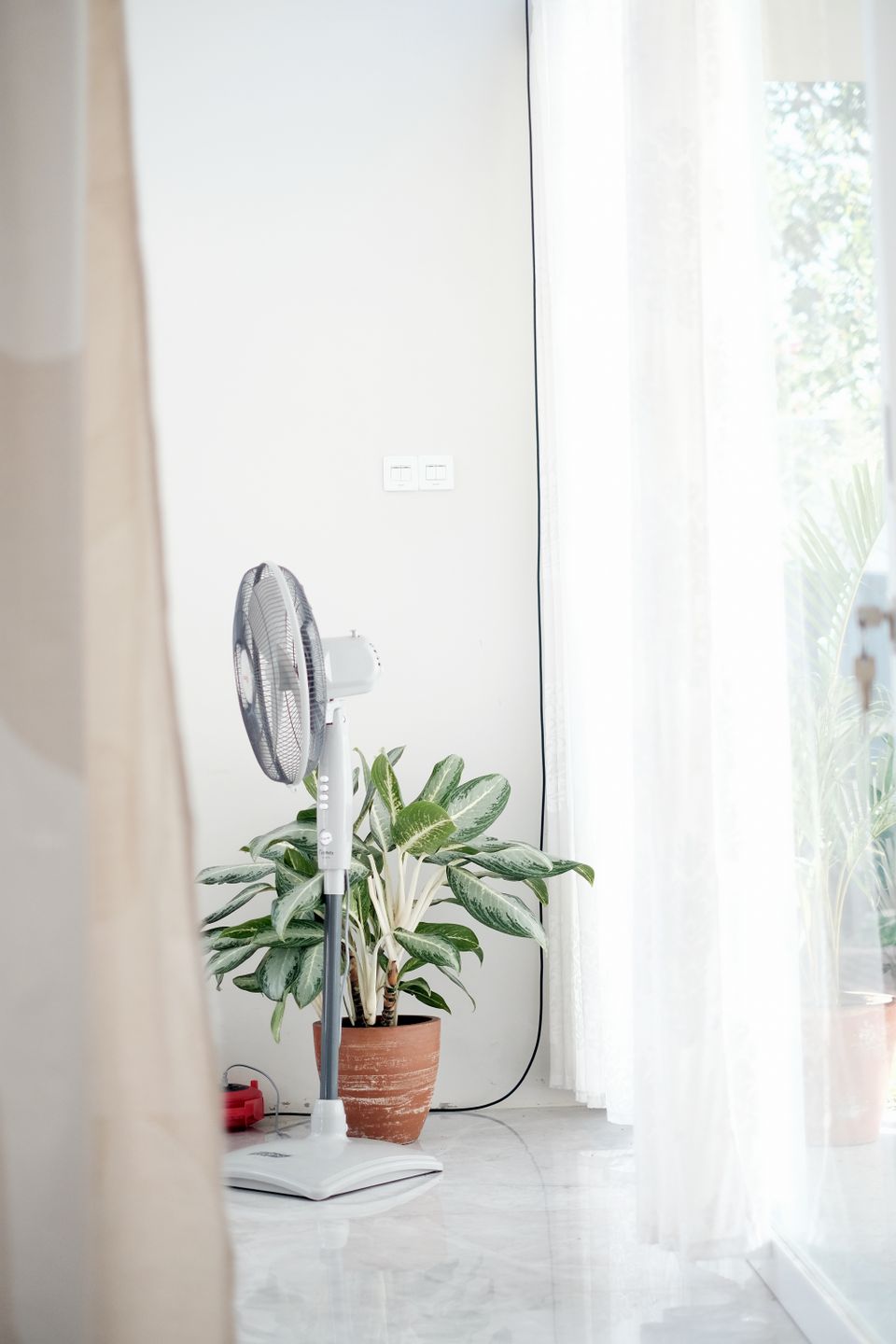 Modern standing fan in living room airflow Modern standing fan in living room airflow