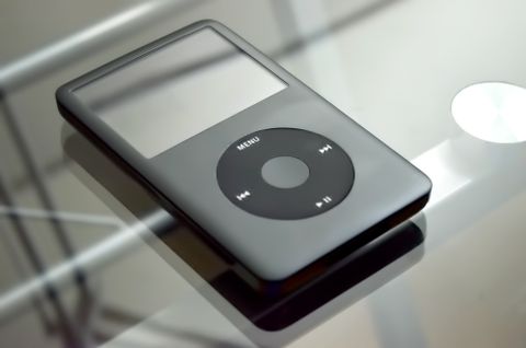 Gray iPod classic style portable music player on a table Gray iPod classic style portable music player on a table