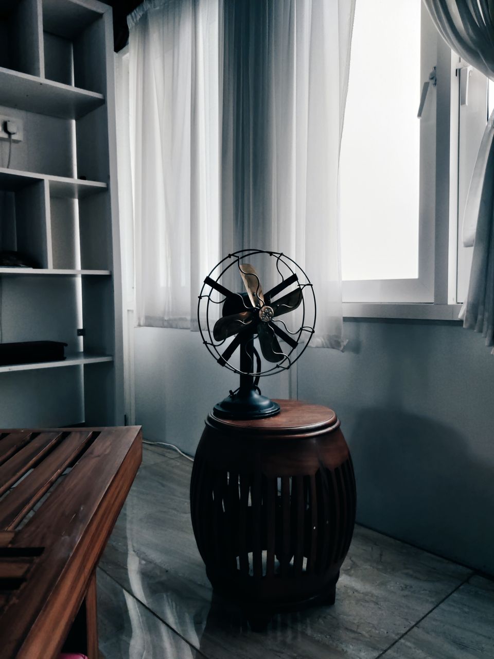 Vintage-style fan cooling a sunlit room Vintage-style fan cooling a sunlit room