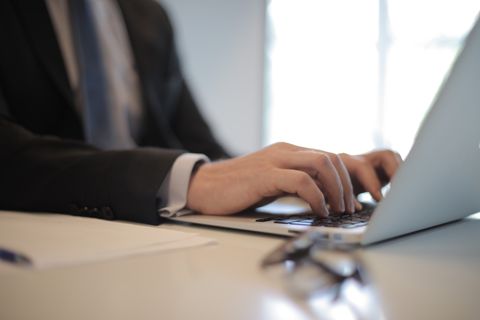 Person installing driver software on a laptop computer Person installing driver software on a laptop computer