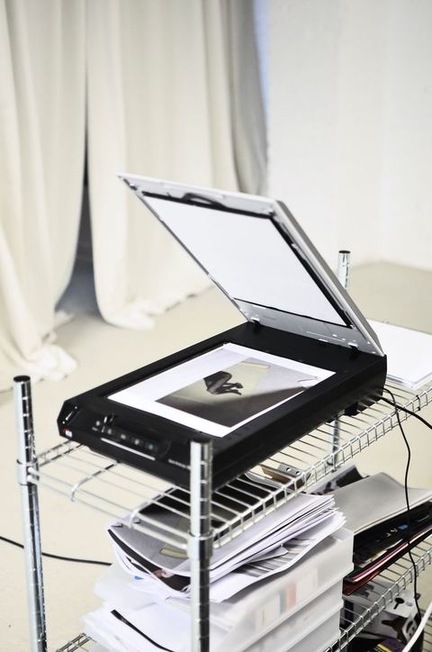 Flatbed scanner open with a photo on the glass Flatbed scanner open with a photo on the glass