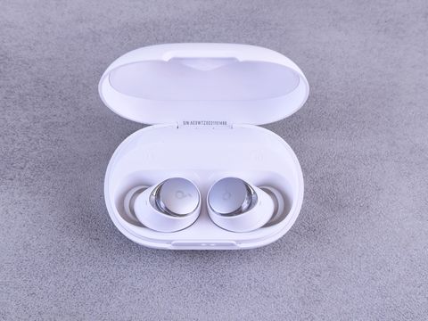 Open charging case showing a pair of Anker Soundcore earbuds seated inside Open charging case showing a pair of Anker Soundcore earbuds seated inside