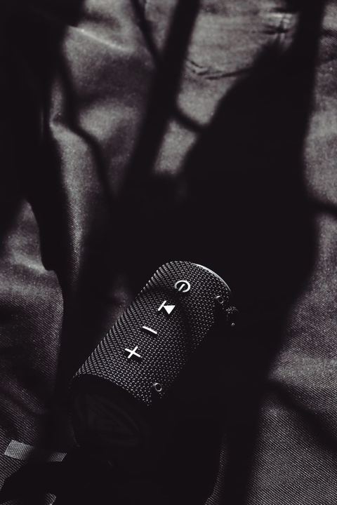 Close-up of Bluetooth speaker control buttons and power light Close-up of Bluetooth speaker control buttons and power light