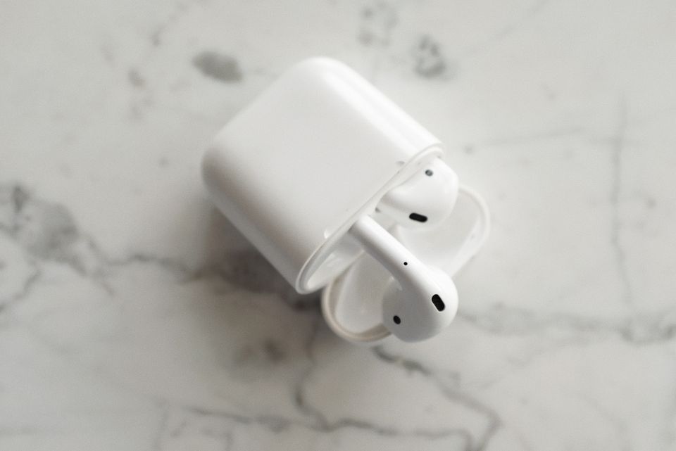 Top view of wireless earbuds resting in open case Top view of wireless earbuds resting in open case