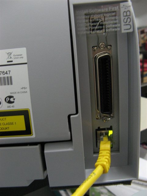Rear connection ports on a laser printer including USB and network interfaces Rear connection ports on a laser printer including USB and network interfaces