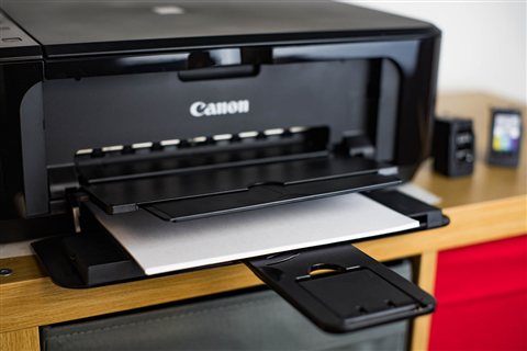 Printer paper tray loaded and ready for automatic document feeding