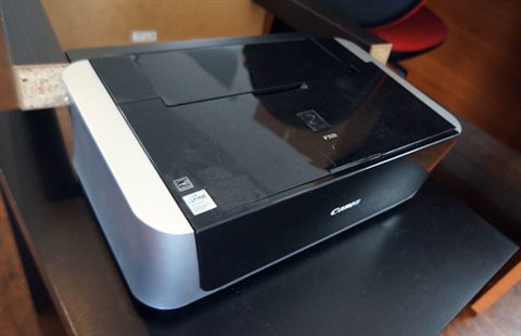 Canon PIXMA series printer with paper output tray extended for printing Canon PIXMA series printer with paper output tray extended for printing