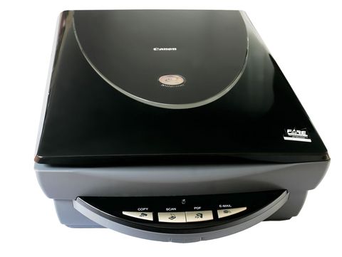Canon flatbed scanner open lid showing the internal scanning bed used for photo and document digitizing Canon flatbed scanner open lid showing the internal scanning bed used for photo and document digitizing
