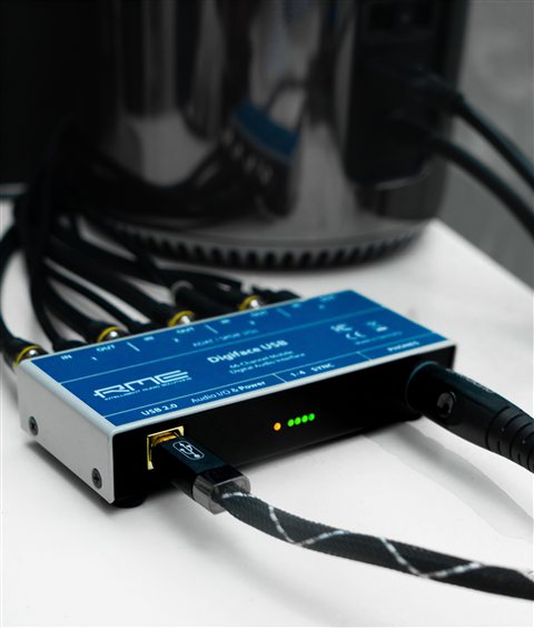 Audio interface connected with cables representing sound card setup process Audio interface connected with cables representing sound card setup process