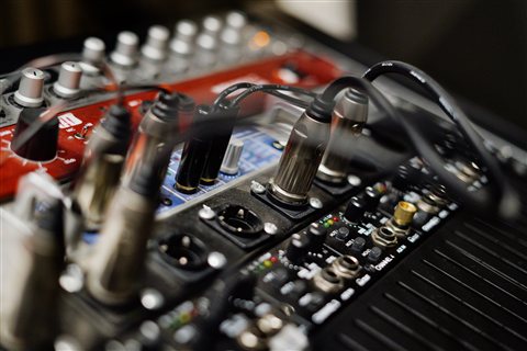 Audio equipment with cables and sound card connections in a studio Audio equipment with cables and sound card connections in a studio