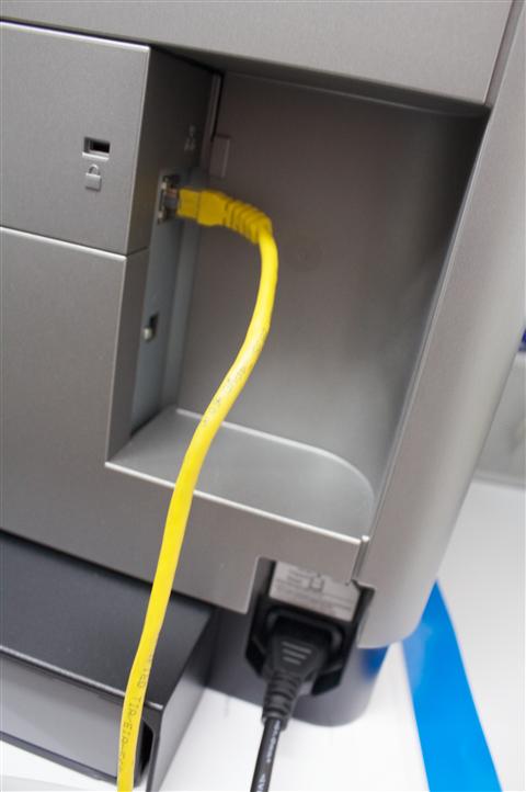 Rear panel view of a Dell network laser printer showing Ethernet and USB port connections Rear panel view of a Dell network laser printer showing Ethernet and USB port connections