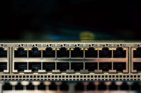 Network switch with multiple status LED indicators lit up Network switch with multiple status LED indicators lit up