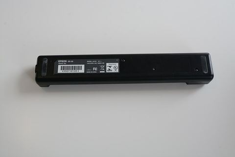 USB flatbed scanner open on a table showing internal glass and cable USB flatbed scanner open on a table showing internal glass and cable