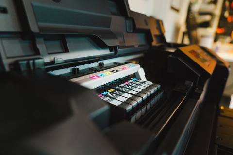 Close-up of color ink cartridges installed inside a printer Close-up of color ink cartridges installed inside a printer