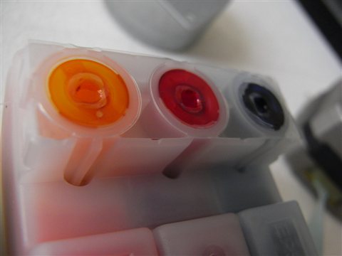 Ink cartridge compartment open on an Epson inkjet printer for maintenance