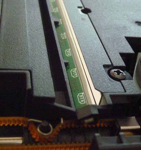 Flatbed scanner lid open showing glass platen for scanning photos Flatbed scanner lid open showing glass platen for scanning photos