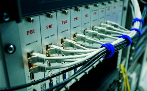 Ethernet cables plugged into a network switch representing a Dell 1130n printer's wired connection Ethernet cables plugged into a network switch representing a Dell 1130n printer's wired connection