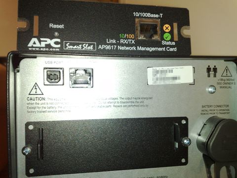 APC Smart-UPS unit with network management card installed on top