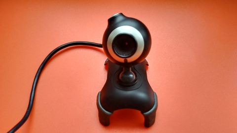 USB webcam clipped to the top of a computer monitor USB webcam clipped to the top of a computer monitor