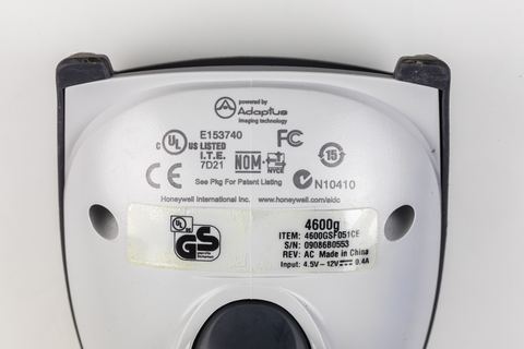 Honeywell 4600g handheld barcode scanner sitting on its charging cradle Honeywell 4600g handheld barcode scanner sitting on its charging cradle