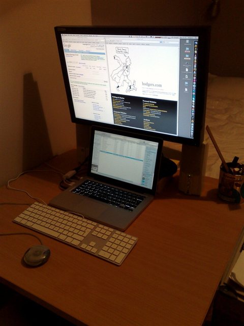 Computer and printer connected together in a small home office workspace Computer and printer connected together in a small home office workspace