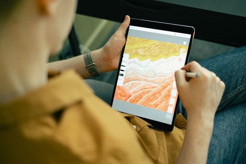 Person sketching digital artwork on a pen display similar to the Kamvas 13 Person sketching digital artwork on a pen display similar to the Kamvas 13