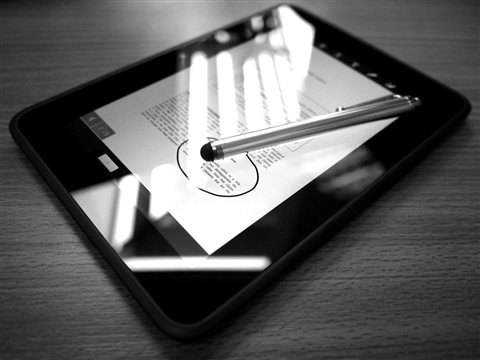 Close up of a stylus pen used for digital annotation on a tablet Close up of a stylus pen used for digital annotation on a tablet