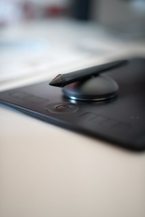 Close up of Huion tablet pen resting on the drawing surface after driver setup
