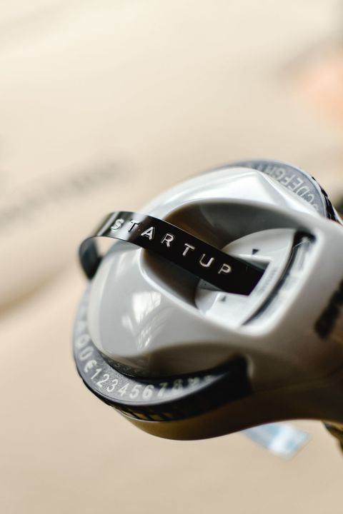 Handheld label making device with numbered dial in close up detail Handheld label making device with numbered dial in close up detail