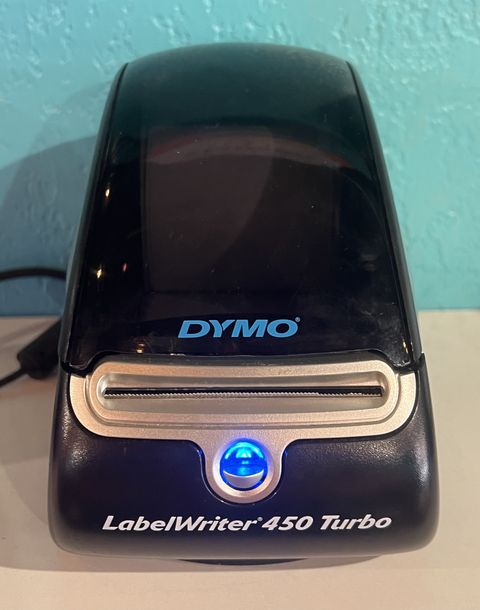 Black label printer with brand logo and model name printed on the front panel Black label printer with brand logo and model name printed on the front panel