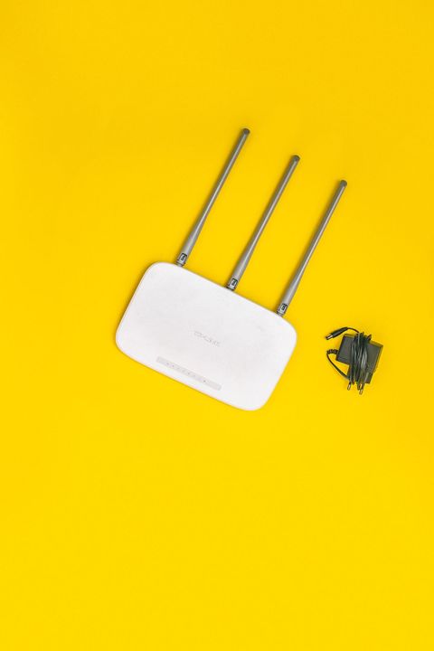 Wireless router with visible antennas representing a home wireless network setup Wireless router with visible antennas representing a home wireless network setup